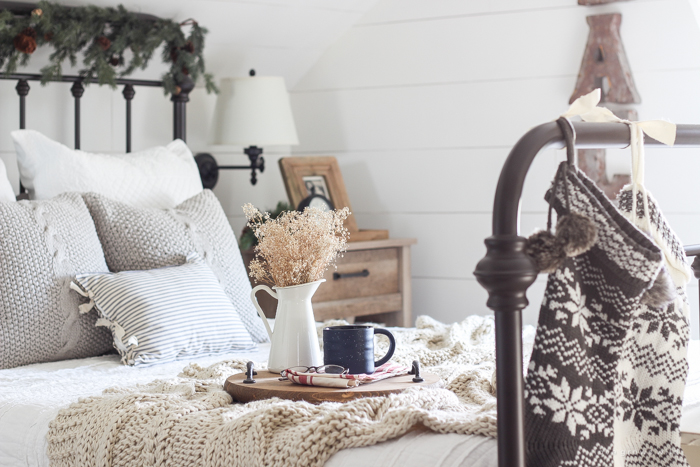 A beautiful farmhouse bedroom decorated for the holidays!