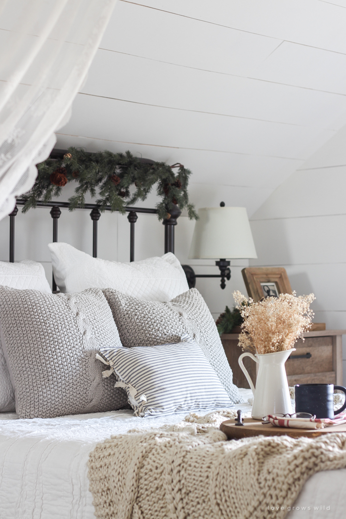 A beautiful farmhouse bedroom decorated for the holidays!