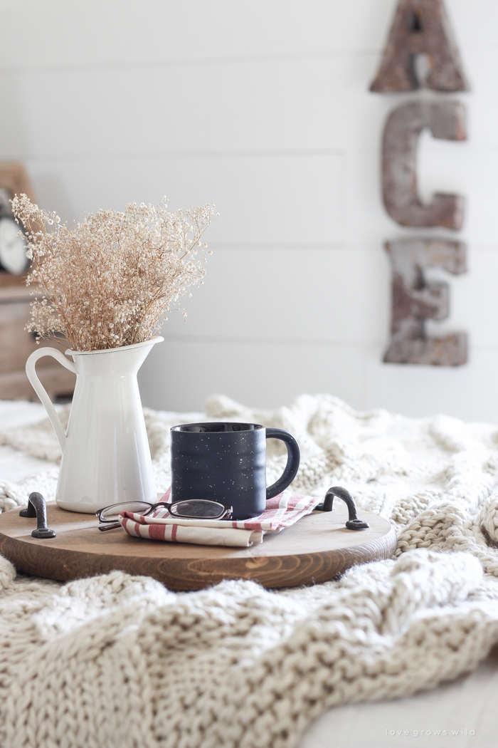 A beautiful farmhouse bedroom decorated for the holidays!