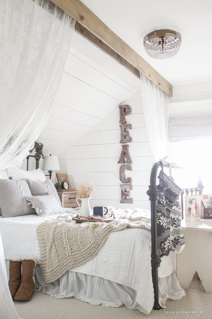 A beautiful farmhouse bedroom decorated for the holidays!