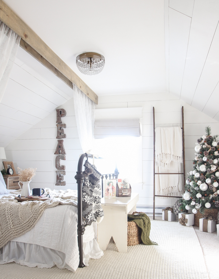 A beautiful farmhouse bedroom decorated for the holidays!