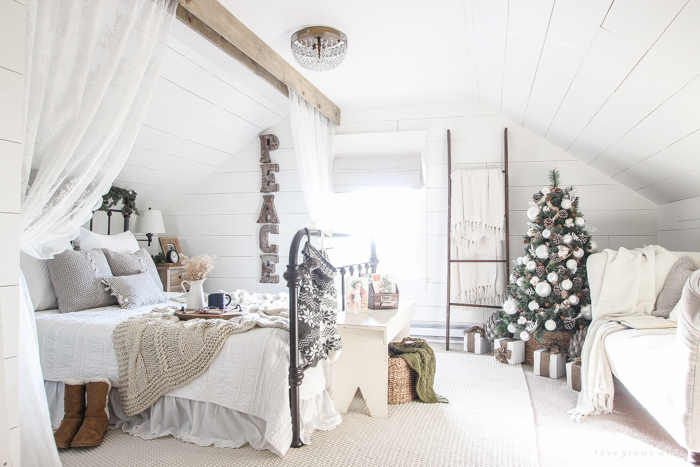 A beautiful farmhouse bedroom decorated for the holidays!