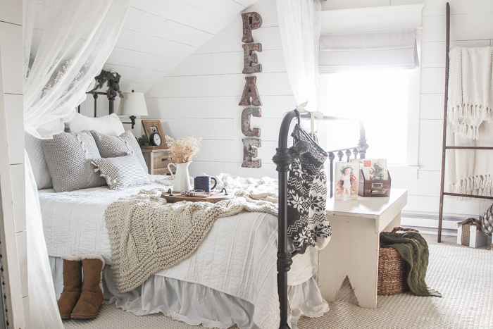 A beautiful farmhouse bedroom decorated for the holidays!