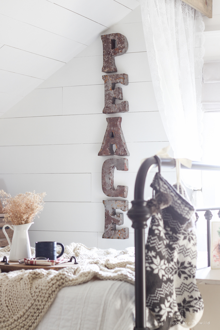 A beautiful farmhouse bedroom decorated for the holidays!