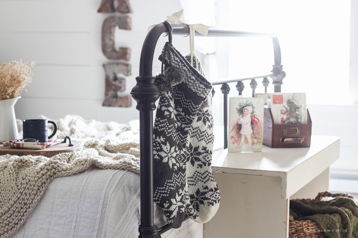 A beautiful farmhouse bedroom decorated for the holidays!