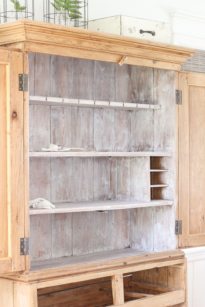 See this antique armoire get a beautiful whitewashed makeover and learn the perfect technique for whitewashing furniture!