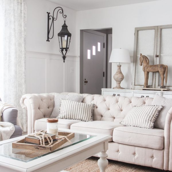 A beautiful farmhouse living room that feels cozy, bright, and totally charming!