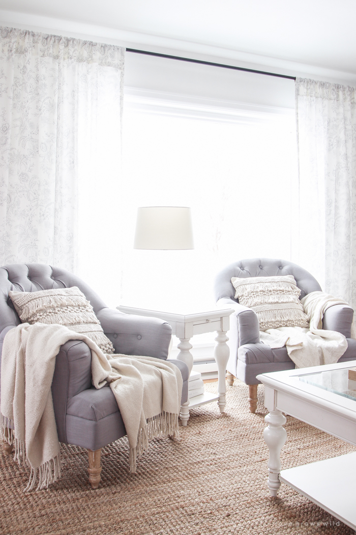 A beautiful farmhouse living room that feels cozy, bright, and totally charming!