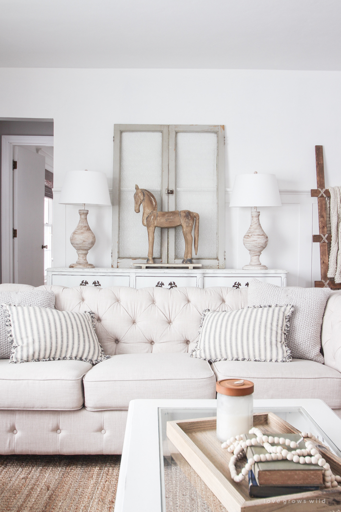 A beautiful farmhouse living room that feels cozy, bright, and totally charming!