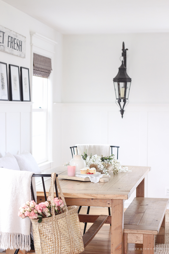 A pretty farmhouse dining room decorated for spring!