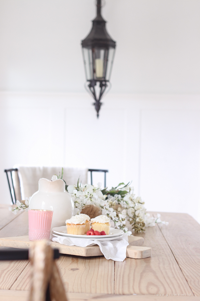 A pretty farmhouse dining room decorated for spring!