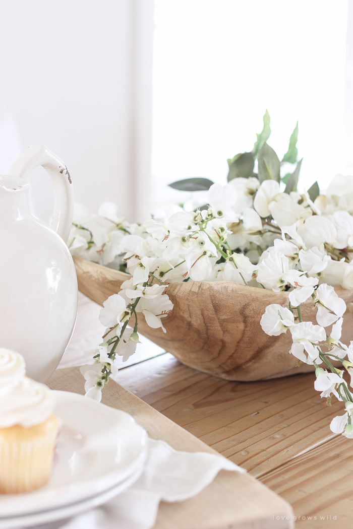 A pretty farmhouse dining room decorated for spring!