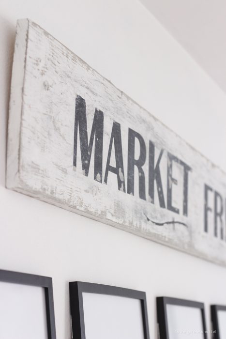 A handmade sign with a beautiful distressed antique finish. Learn how to make this simple and inexpensive DIY vintage Market Fresh sign!