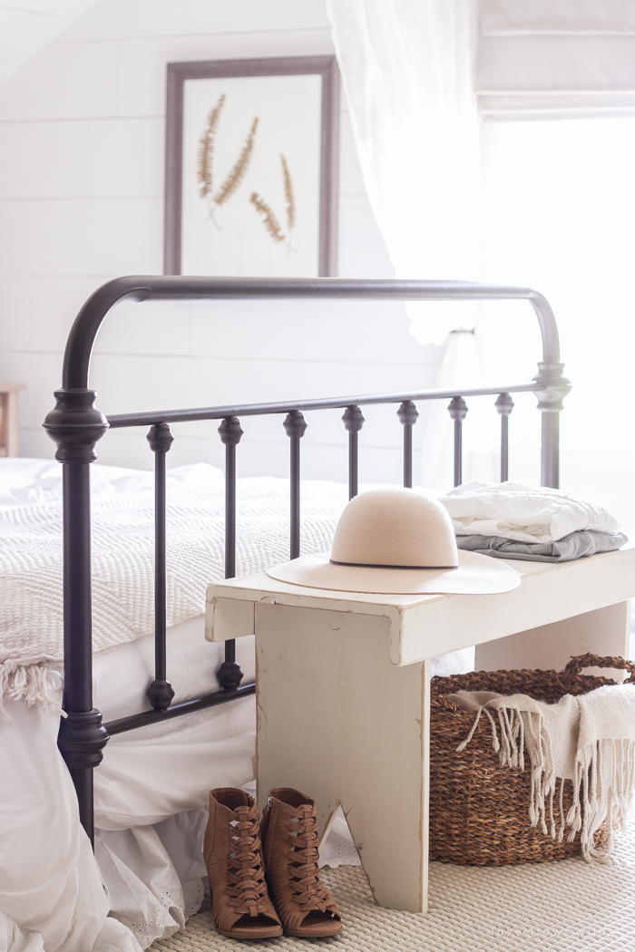 A clean and cozy farmhouse master bedroom with tons of vintage charm