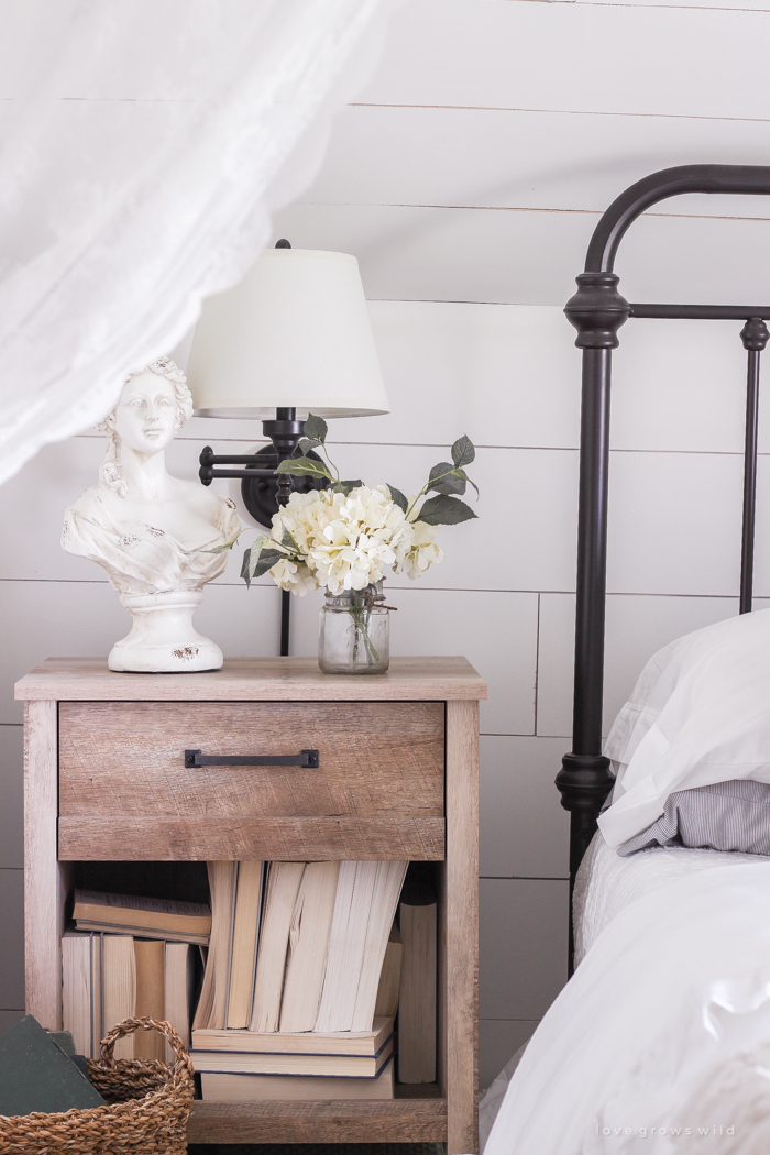 A clean and cozy farmhouse master bedroom with tons of vintage charm