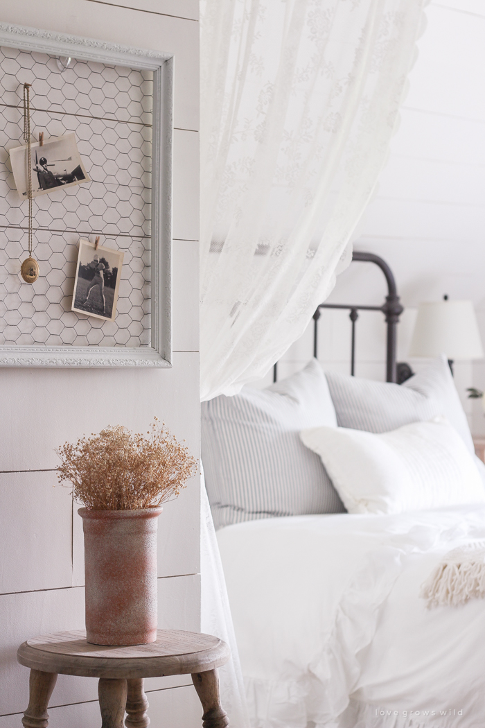 A clean and cozy farmhouse master bedroom with tons of vintage charm