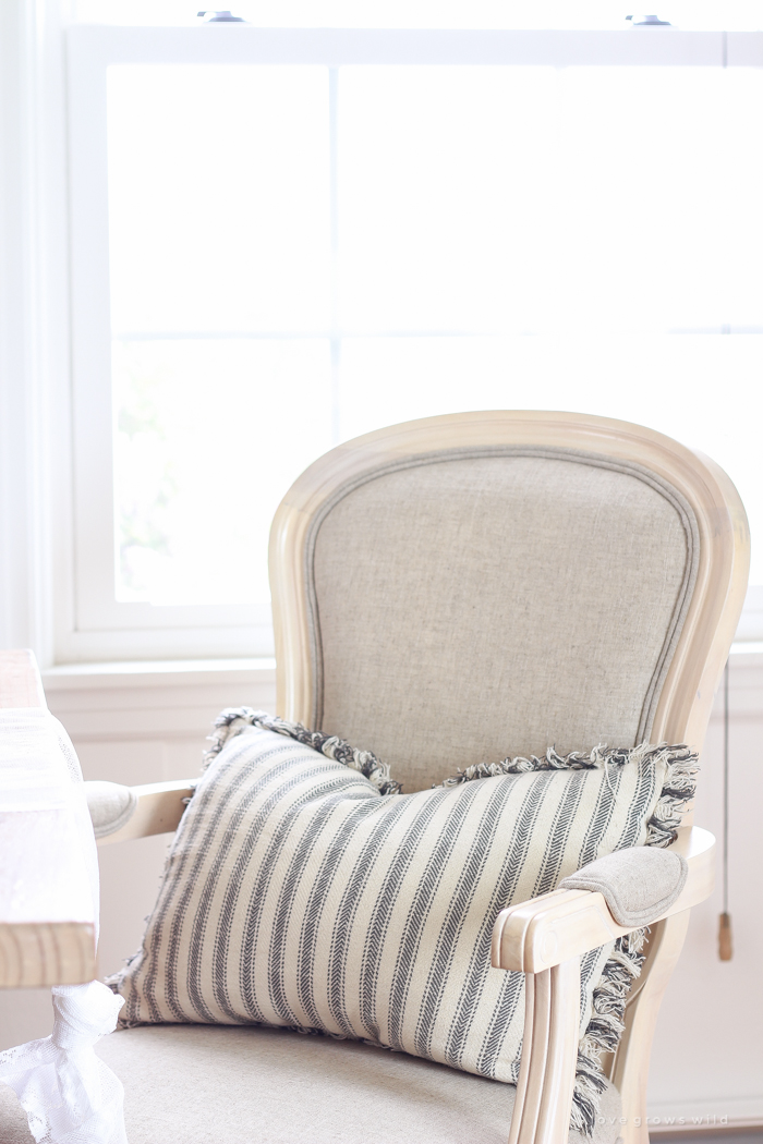 A beautiful farmhouse dining room with a french country twist