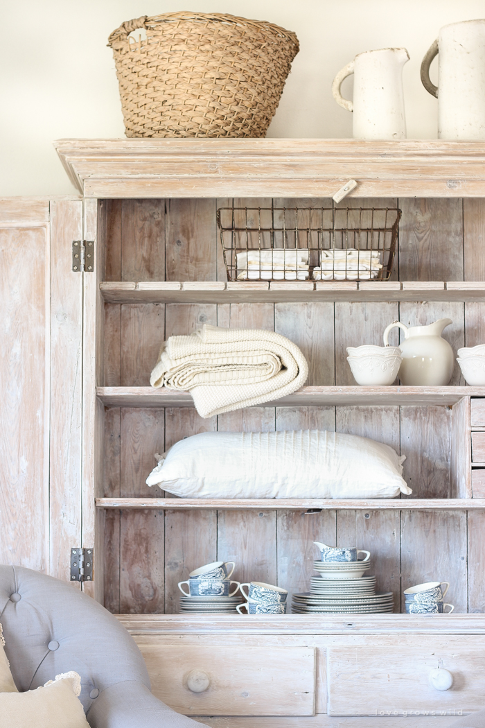 An antique hutch styled simply but beautifully in this Indiana farmhouse