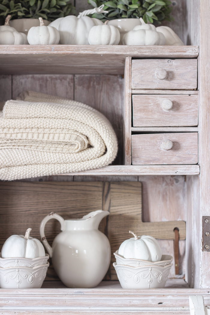 A beautiful farmhouse living room decorated with soft neutrals for fall