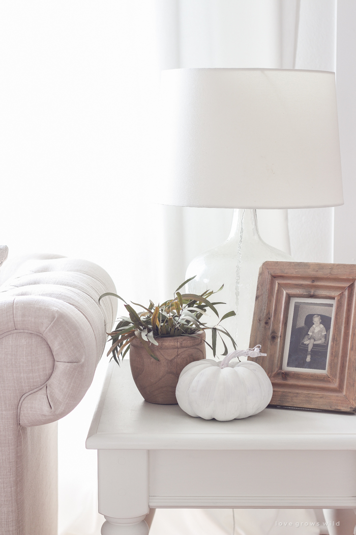 A beautiful farmhouse living room decorated with soft neutrals for fall