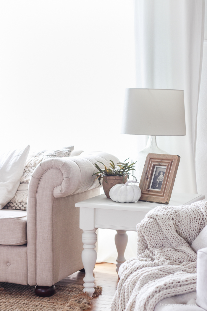 A beautiful farmhouse living room decorated with soft neutrals for fall