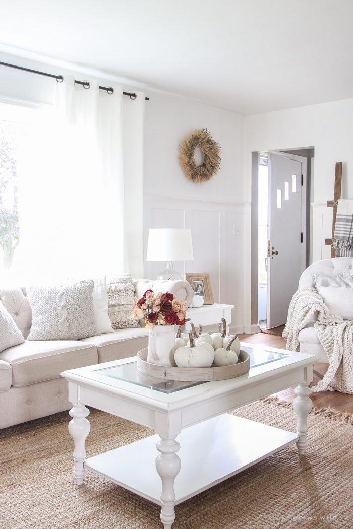 A beautiful farmhouse living room decorated with soft neutrals for fall