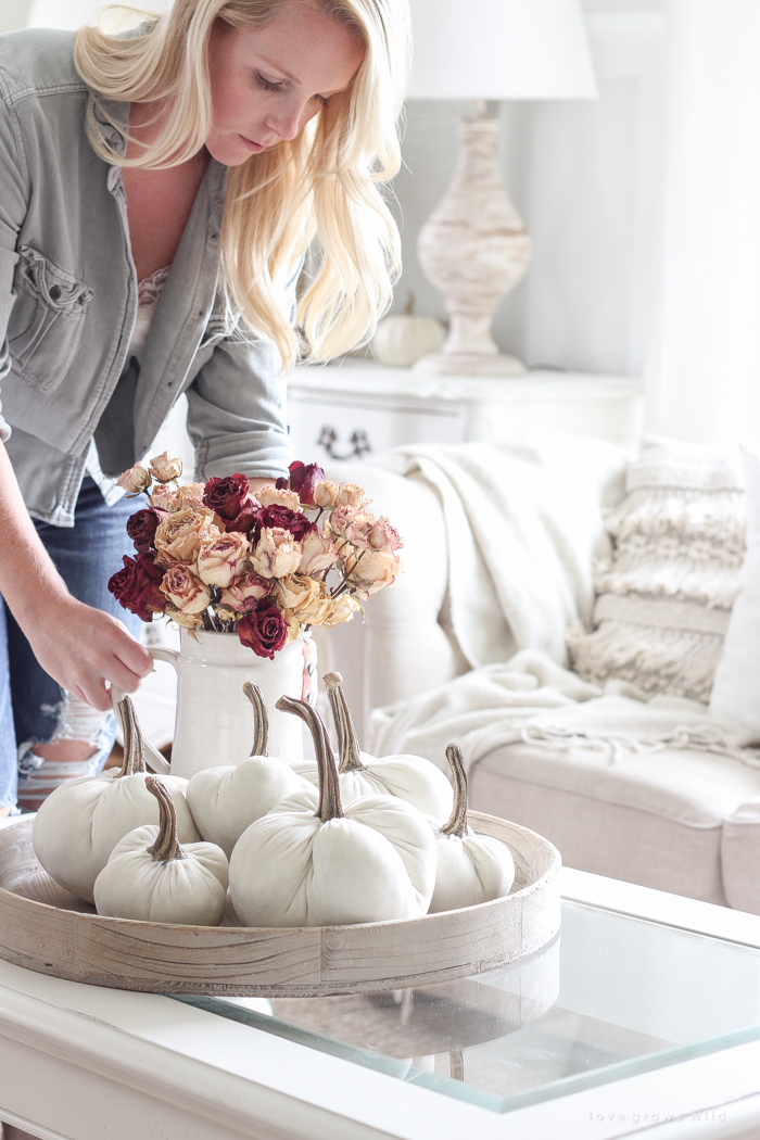 A beautiful farmhouse living room decorated with soft neutrals for fall