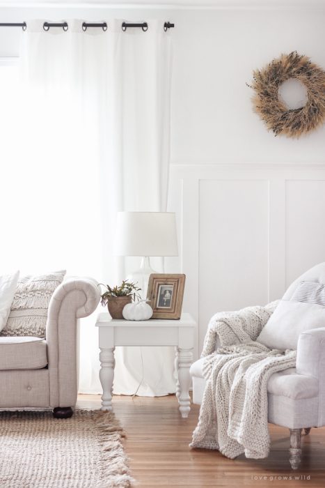A beautiful farmhouse living room decorated with soft neutrals for fall