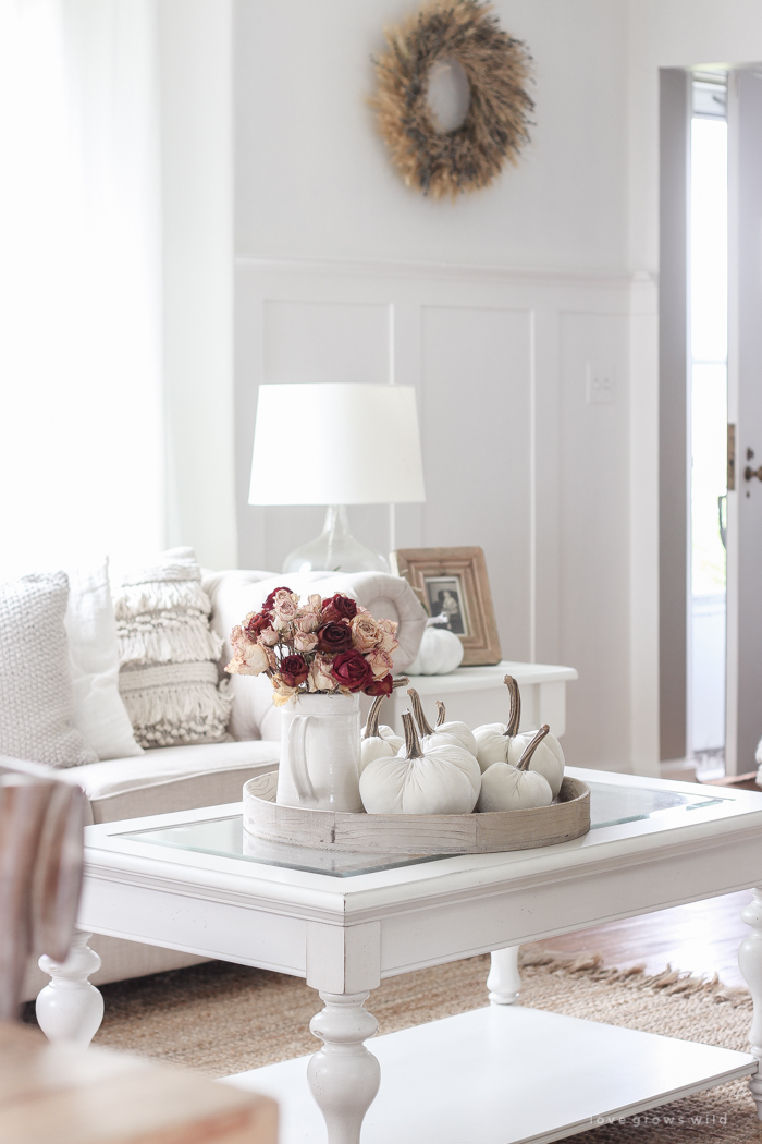 A beautiful farmhouse living room decorated with soft neutrals for fall