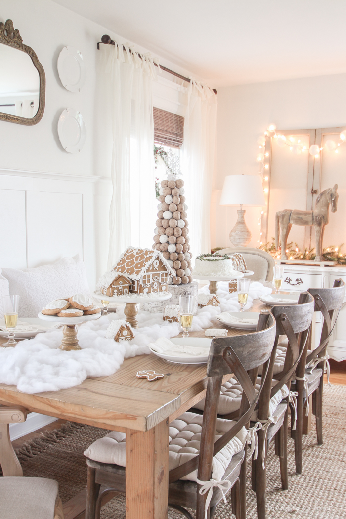 This adorable dessert table is perfect for the holidays and kids! Celebrate Christmas with gingerbread houses, a donut tree, festive cakes, cookies and more!