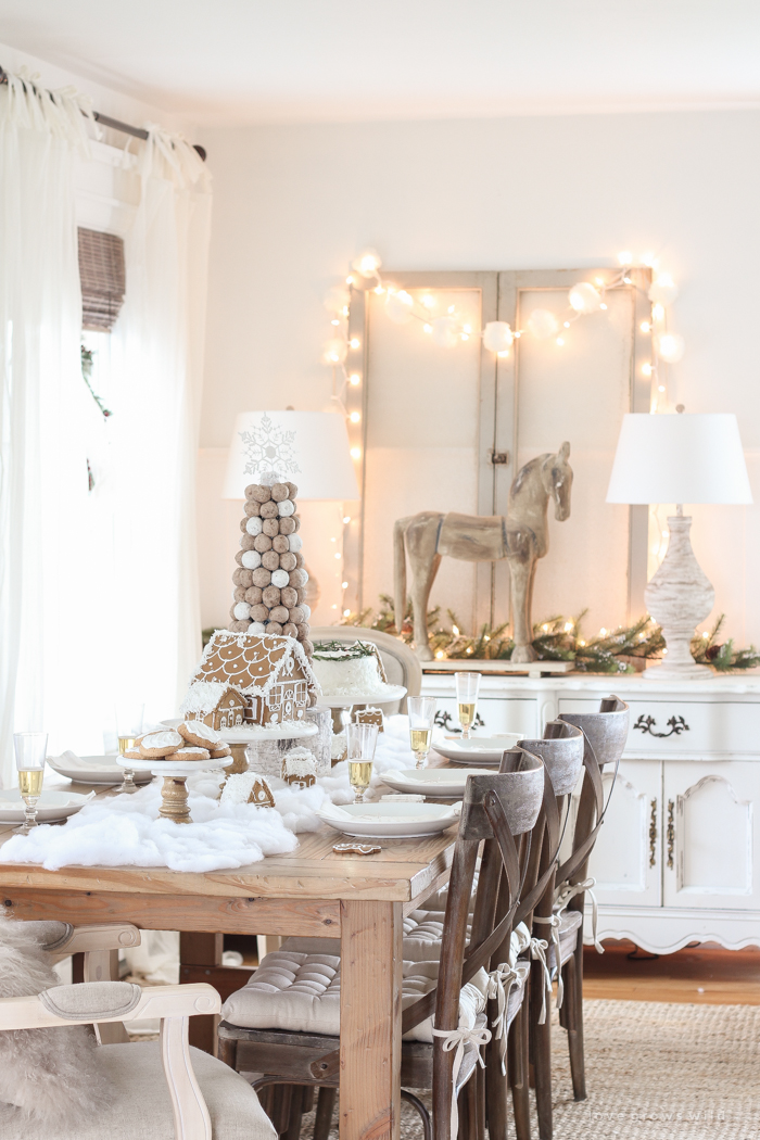 This adorable dessert table is perfect for the holidays and kids! Celebrate Christmas with gingerbread houses, a donut tree, festive cakes, cookies and more!