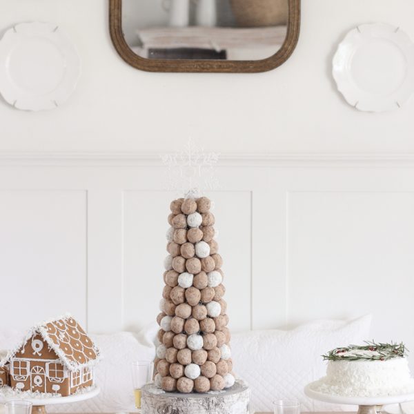 This adorable dessert table is perfect for the holidays and kids! Celebrate Christmas with gingerbread houses, a donut tree, festive cakes, cookies and more!