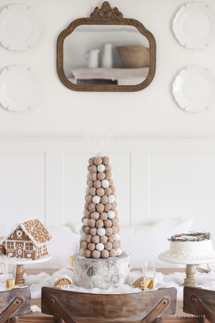 This adorable dessert table is perfect for the holidays and kids! Celebrate Christmas with gingerbread houses, a donut tree, festive cakes, cookies and more!