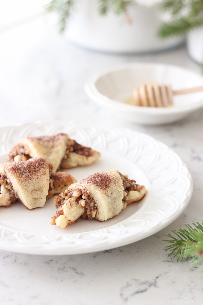 Tender, flaky pastries wrapped with a delicious honey nut filling and sprinkled with a hint of cinnamon sugar on top! These tasty treats are perfect for the holidays or any time of year!