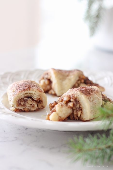 Tender, flaky pastries wrapped with a delicious honey nut filling and sprinkled with a hint of cinnamon sugar on top! These tasty treats are perfect for the holidays or any time of year!