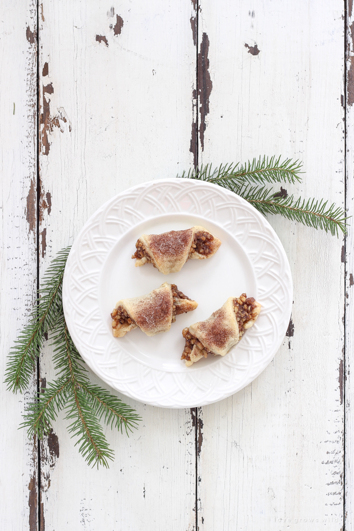 Tender, flaky pastries wrapped with a delicious honey nut filling and sprinkled with a hint of cinnamon sugar on top! These tasty treats are perfect for the holidays or any time of year!