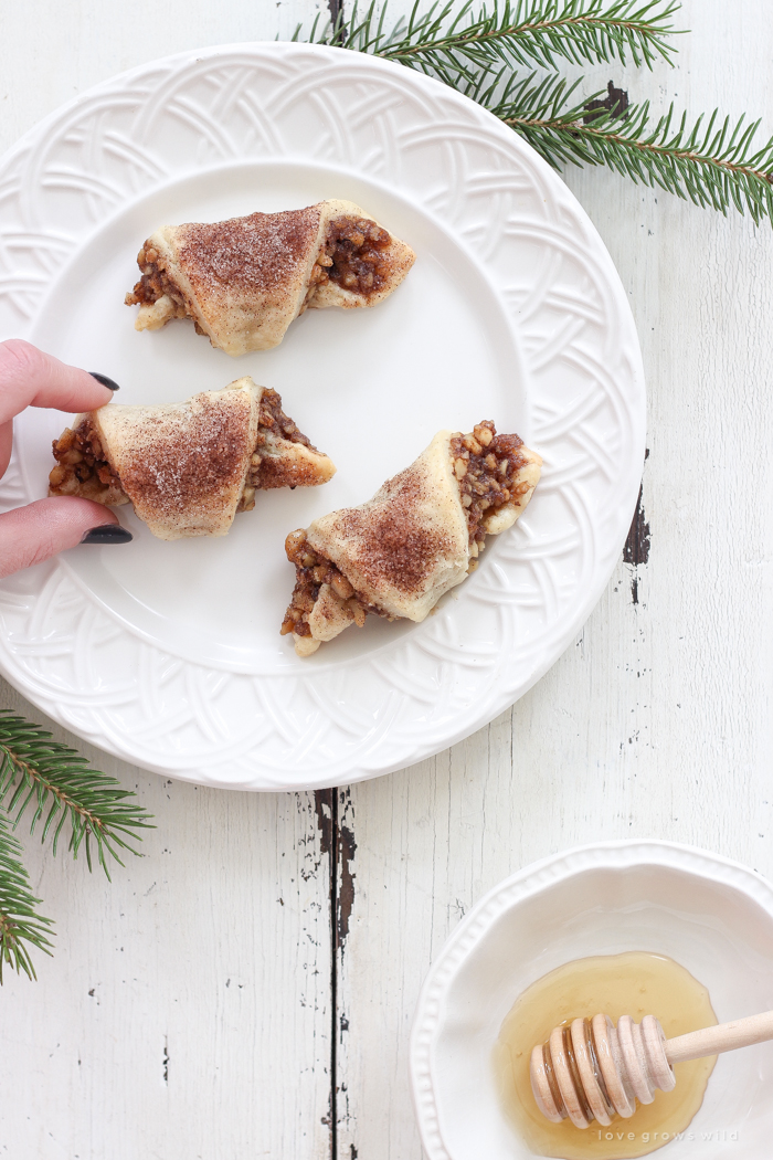 Tender, flaky pastries wrapped with a delicious honey nut filling and sprinkled with a hint of cinnamon sugar on top! These tasty treats are perfect for the holidays or any time of year!