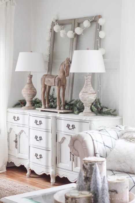 A beautiful farmhouse living room decorated in soft neutrals for the holidays!