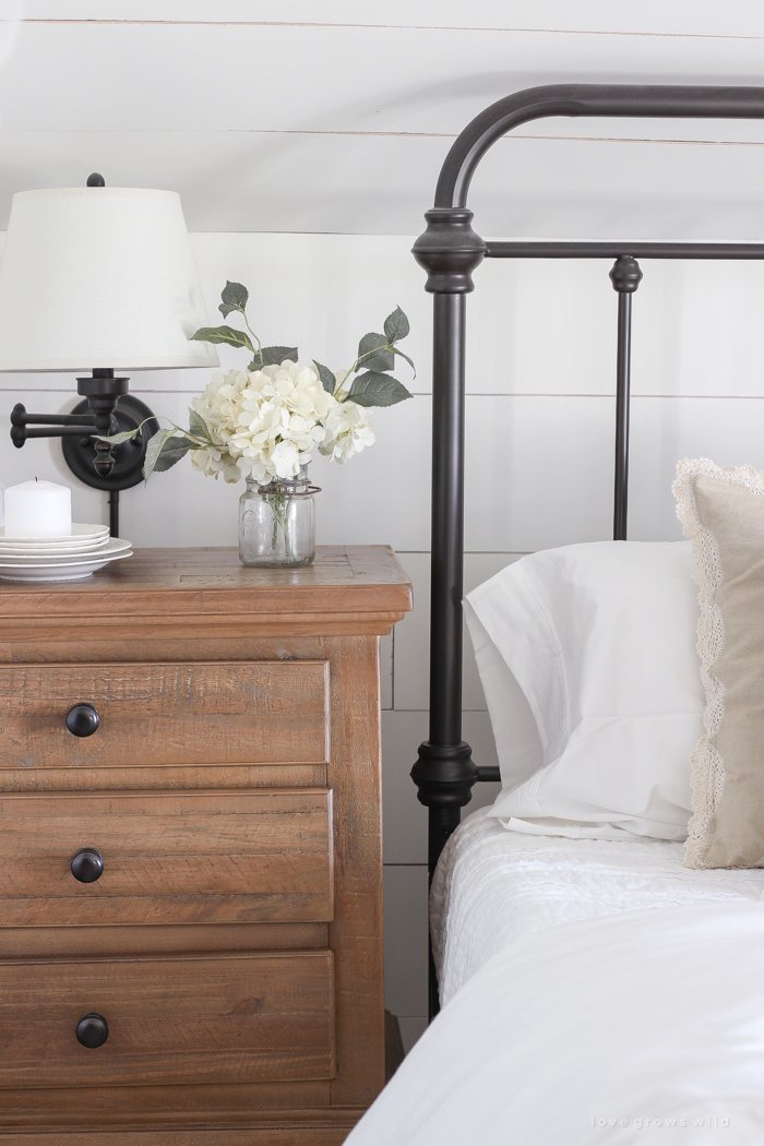 This cozy master bedroom is beautifully decorated for Christmas with soft neutrals and tons of farmhouse charm. 