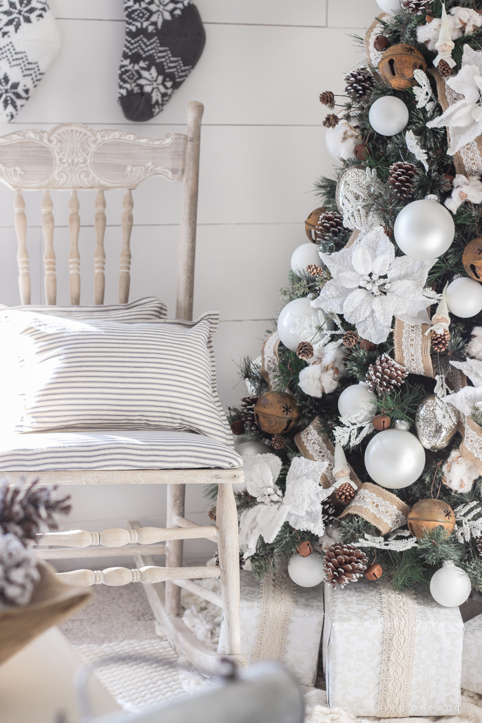 This cozy master bedroom is beautifully decorated for Christmas with soft neutrals and tons of farmhouse charm.