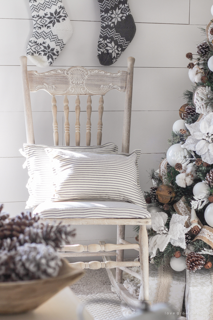 This cozy master bedroom is beautifully decorated for Christmas with soft neutrals and tons of farmhouse charm. 