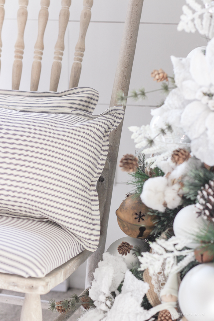 This cozy master bedroom is beautifully decorated for Christmas with soft neutrals and tons of farmhouse charm. 