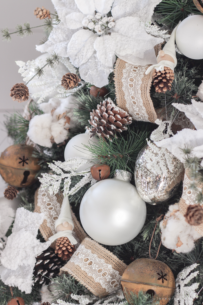 This cozy master bedroom is beautifully decorated for Christmas with soft neutrals and tons of farmhouse charm.