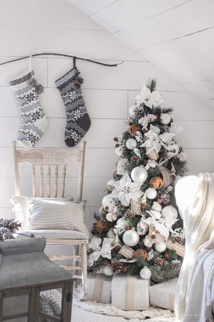 This cozy master bedroom is beautifully decorated for Christmas with soft neutrals and tons of farmhouse charm. 