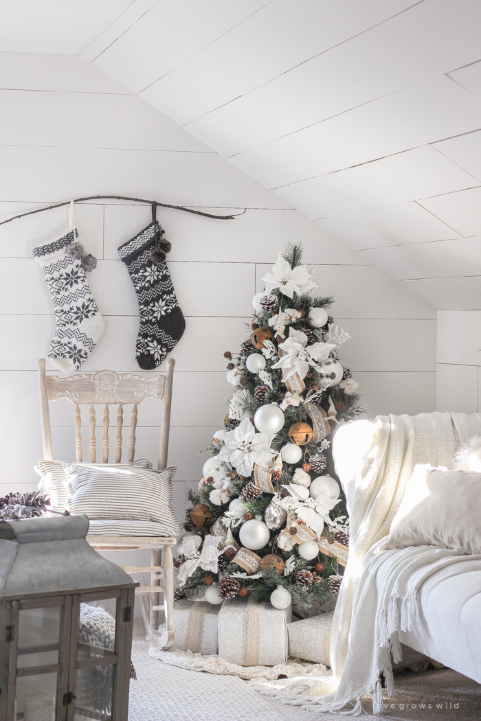 This cozy master bedroom is beautifully decorated for Christmas with soft neutrals and tons of farmhouse charm.