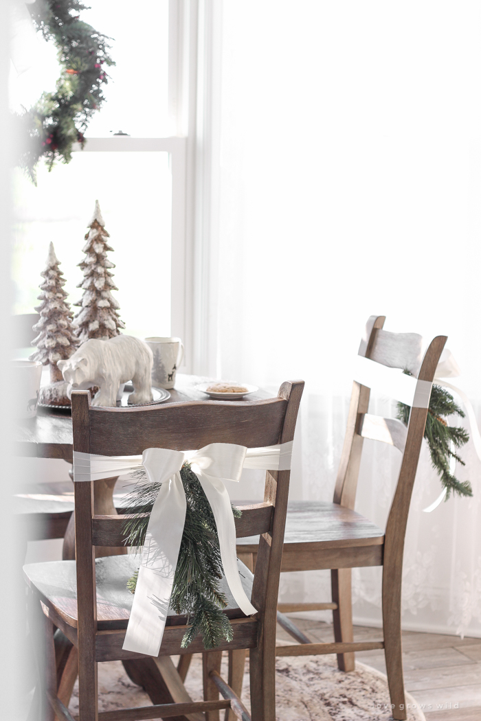 Step inside this beautiful farmhouse and discover a winter wonderland themed kitchen decorated for Christmas with simple touches of greenery and winter charm!