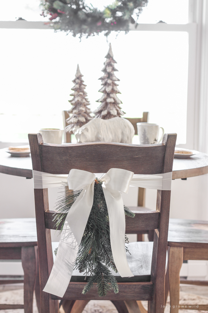 Step inside this beautiful farmhouse and discover a winter wonderland themed kitchen decorated for Christmas with simple touches of greenery and winter charm!