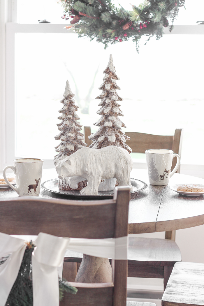 Step inside this beautiful farmhouse and discover a winter wonderland themed kitchen decorated for Christmas with simple touches of greenery and winter charm!