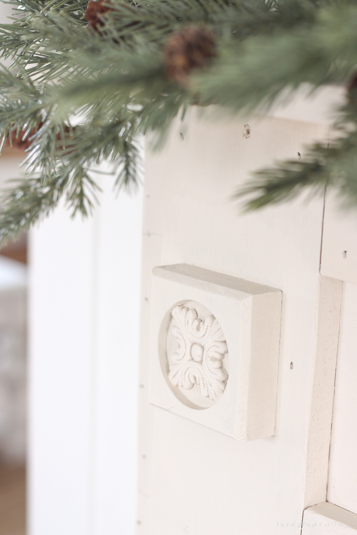 A rustic mantel is given a big makeover for the holidays! See how milk paint transformed this cozy cottage mantel.