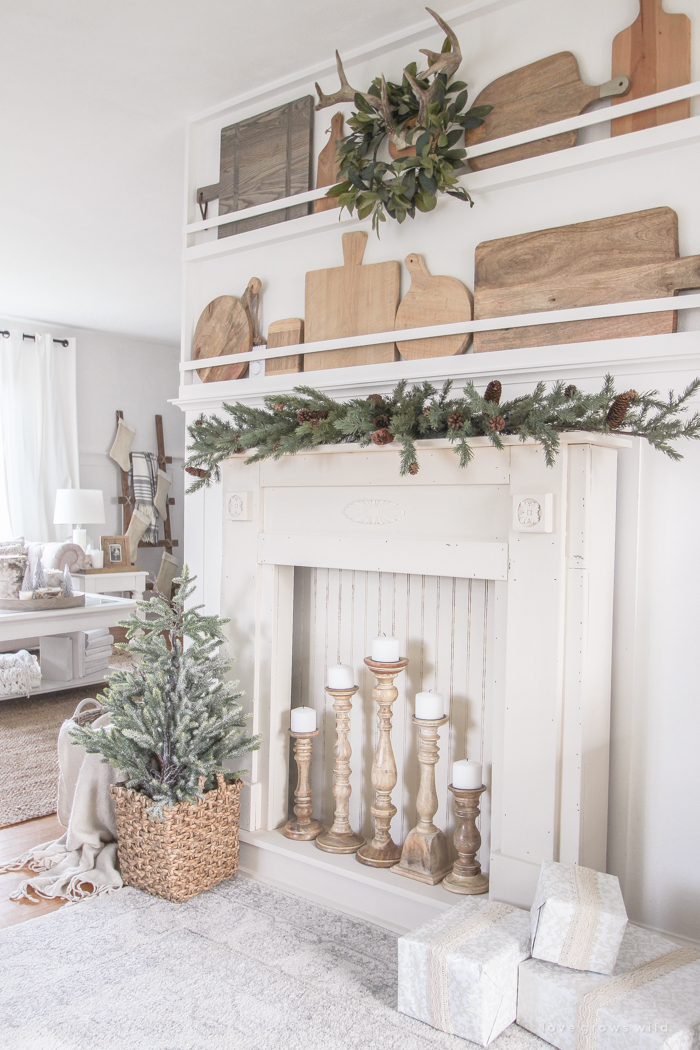 A rustic mantel is given a big makeover for the holidays! See how milk paint transformed this cozy cottage mantel.